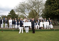 Bowls club hands over £1,572 to dementia charity