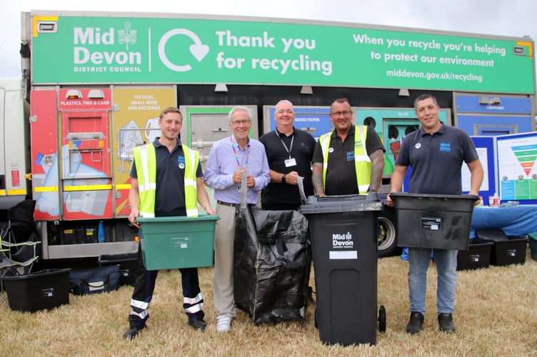 Members of Mid Devon Recycling Team with, second left, Cllr Colin Slade, MDDC cabinet member for the environment and climate change with the seagull sack and new bin, centre, at the recent Mid Devon Show.  AQ 7560
