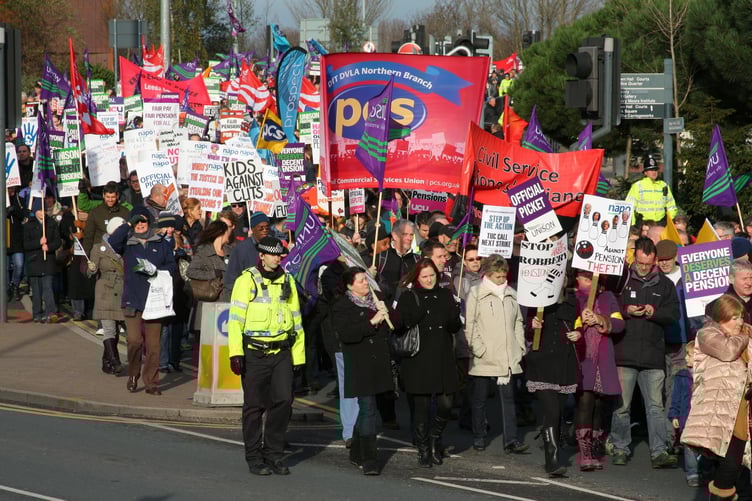 Members of the PCS and UNISON unions taking industrial action