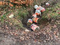 Fly-tippers caught on camera dumping empty cans