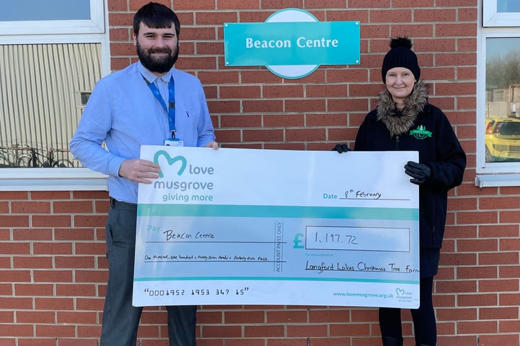 Trudy Hendy from the Crafts@Christmas shop at Langford Lakes Christmas Tree Farm with Elliott Collett, Fundraising Assistant at Love Musgrove
