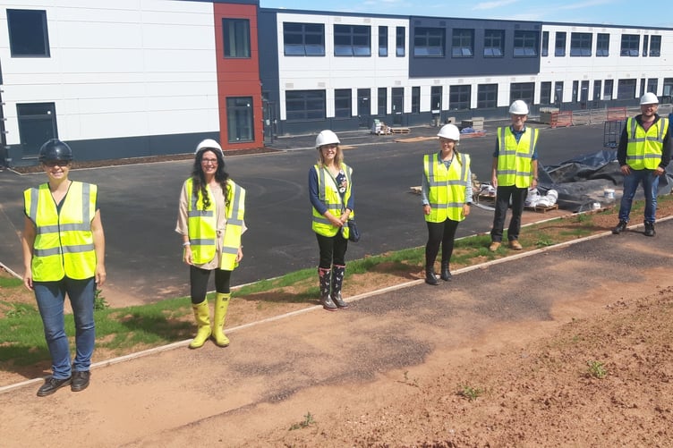 Teaching staff standing outside the new Isambard Kingdom Brunel Primary School in Wellington