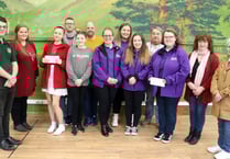 Charity fundraisers presented cheque from carnival committee 