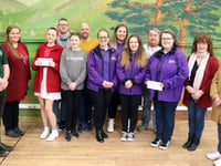 Charity fundraisers presented cheque from carnival committee 