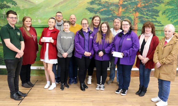 Charity fundraisers accept their cheque from the Wellington Carnival after collecting at the event last September
