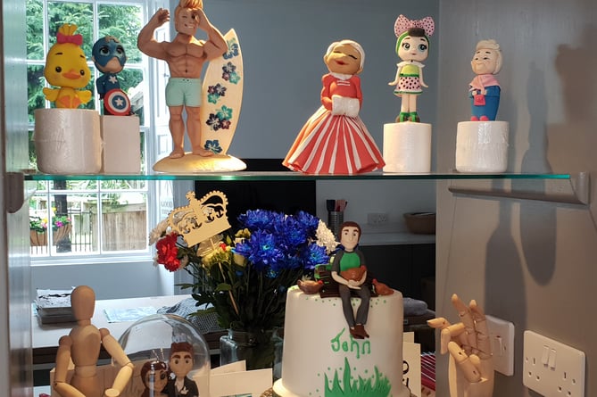 Some of the cake topping models made by Lesley Retallack – with the one on the top right being a representation of the late Queen Elizabeth II.