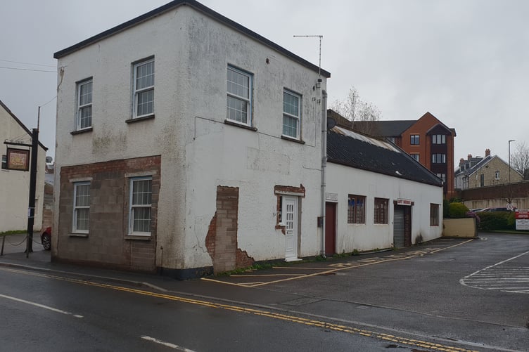 The former carpet warehouse in North Street, Wellington, with the Victoria Arms car park to the left and Bishops Court retirement flats to the rear.