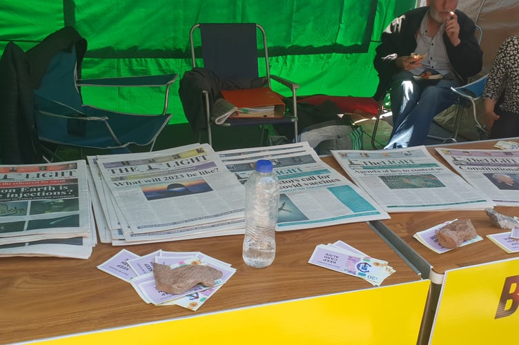 Anti-vaxxers distributing the conspiracy theory publication The Light at Wellington Street Fair.