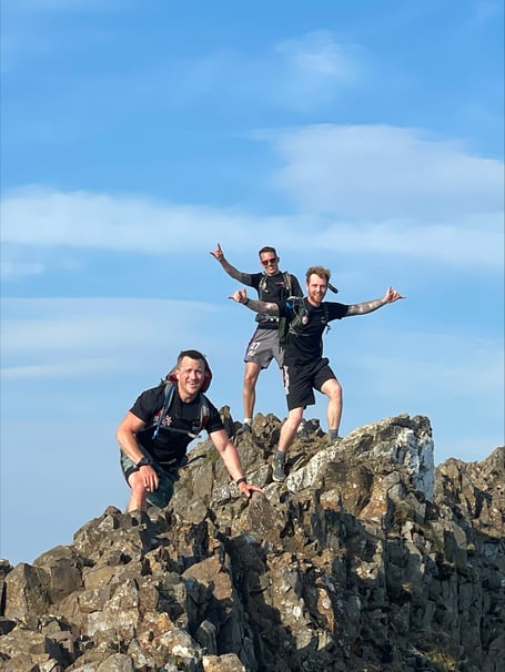 A team of fire fighters have scaled 14 peaks in aid of raising money for charity