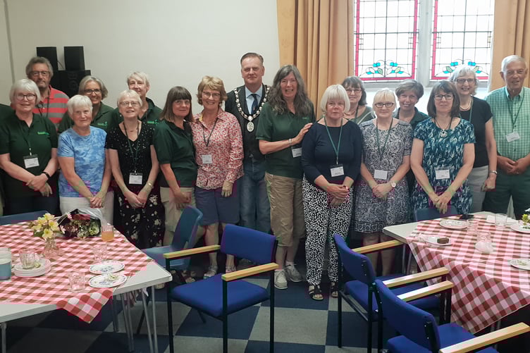 Wellington Mayor Cllr Marcus Barr (centre) visited The town's foodbank to help mark its 10th anniversary.