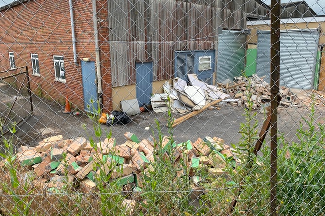 Piles of rubble and filled skips have been seen on the site where much of the interior building is being ripped out