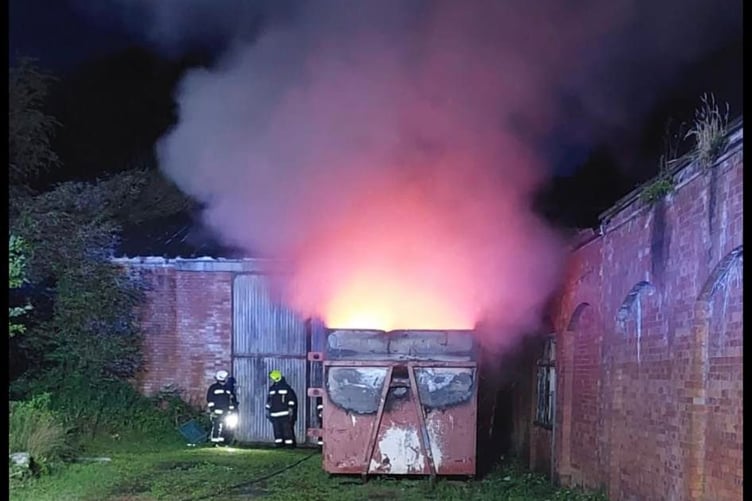 Fire fighters arrived on the scene to discover a skip containing building materials well alight