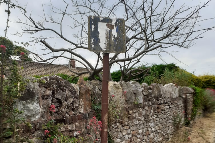 A Sampford Moor sign seen perished to nothing