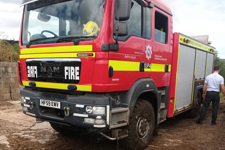 Firefighters at the scene of the river rescue after the Dunkeswell aircraft forced landing.