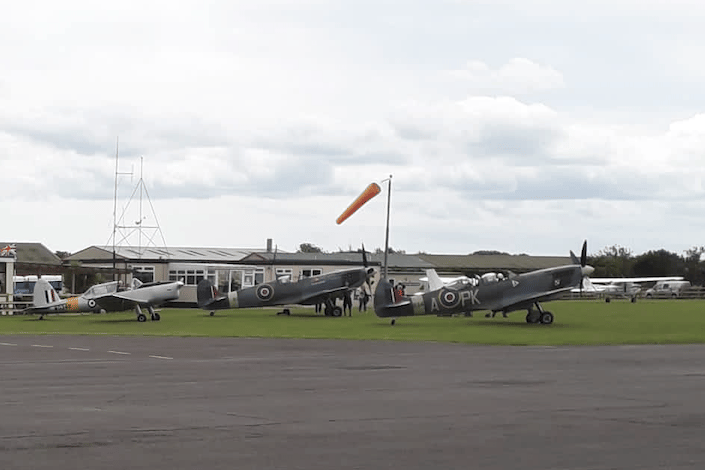 Spitfires on the ground at Dunkeswell Aerodrome.