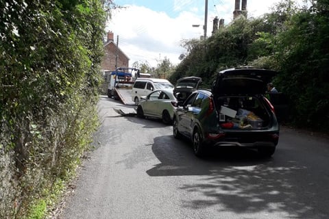 A vehicle recovery truck seen working to clear the road