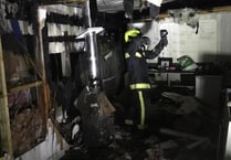 Firefighters battle outbuilding blaze