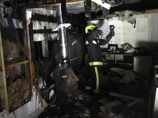 Firefighters battle outbuilding blaze