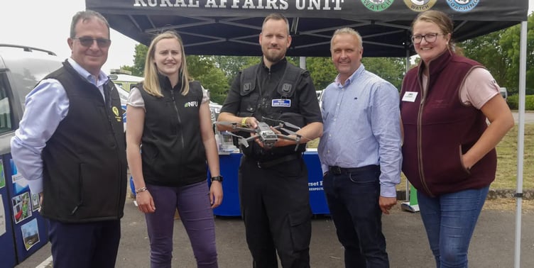 PC Stefan Edwards with (left to right) Andrew Smith, Emily Martin, Jeremy Padfield, and Lindsay Isga,r of the NFU and NFU Mutual.