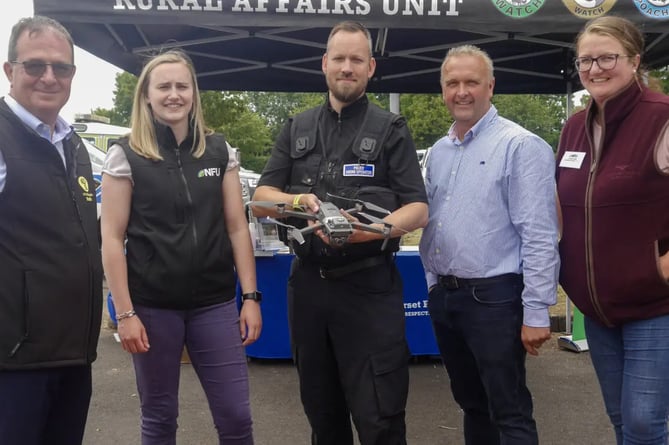 PC Stefan Edwards with (left to right) Andrew Smith, Emily Martin, Jeremy Padfield, and Lindsay Isga,r of the NFU and NFU Mutual.