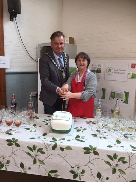 Mayor Marcus Barr helped cut the anniversary cake