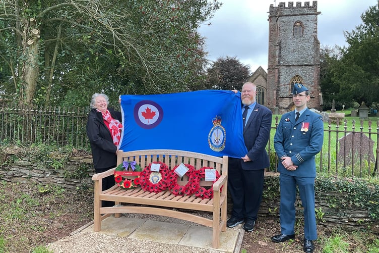 Rob Peters and his wife, watched by Major David Hardy, unveil a memorial to five Canadian airmen who died in World War Two crash in Broomfield.