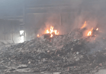 Fires continue to burn in devastated recycling centre
