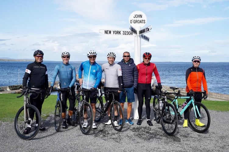MK Test Systems non-executive director Carl Bullock and his fellow charity cyclists before setting off from John O'Groats.