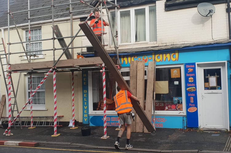 Scaffolders at work on the empty Chic-O-Land takeaway premises in Wellington.