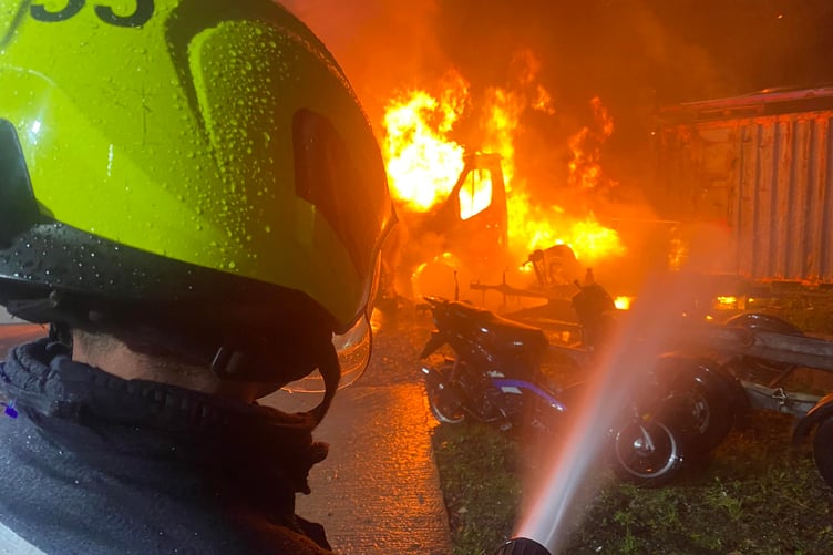 Fire crews try to save cars alight on the Foxmoor Business Park, near Wellington.
