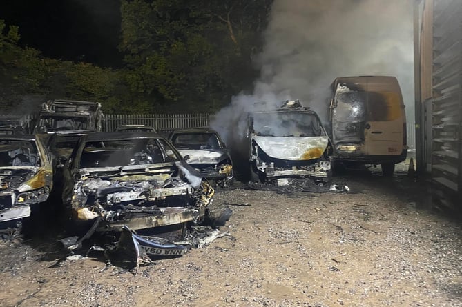 The wrecks of some of the 35 vehicles destroyed in an arson attack on Foxmoor Business Park, near Wellington.
