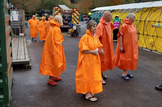 Casualty Union volunteers being prepared for mass decontamination during a firefighting exercise.