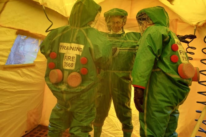 Wellington fire crews taking part in a mass decontamination training exercise.