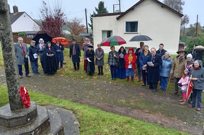 Retired vicar the Rev Dr Maria Hearl led a remembrance service at the war memorial in Sampford Arundel on Sunday.