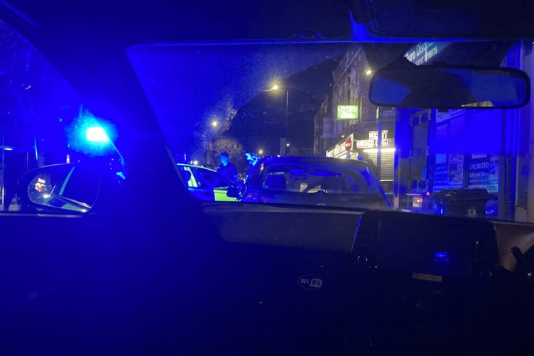 Blue lights illuminate the scene as police swoop as part of Operation calibre.