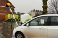 Woman injured after car collides with zebra crossing post 