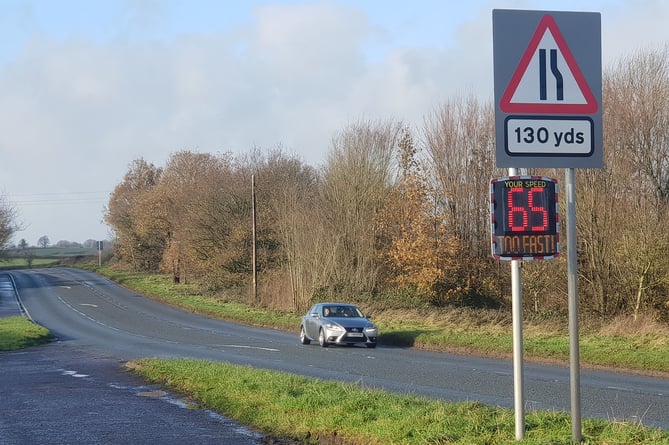 A speed indicator device on the A38 near Perry Elm records an approaching car (not in the photo) driving at 65 mph.