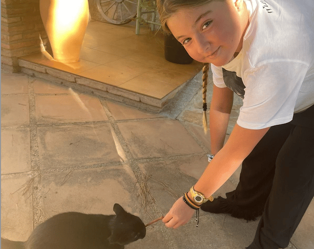 Harper Pumfrey with her family cat.