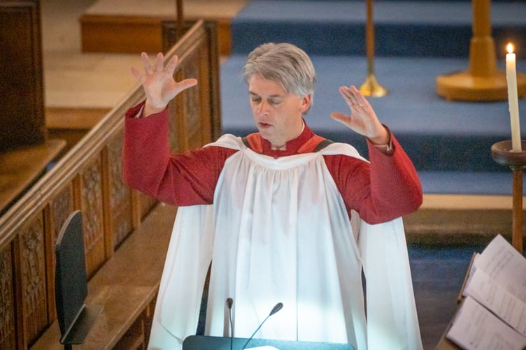 Andrew Trewhella conducting at Wellington School's senior carol service.