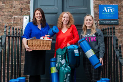 Katherine Goddard and Rosie Hather from Arc on the left of Emma Mackay from Vistry Western with donations. 