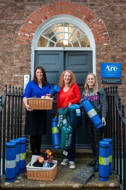 Katherine Goddard and Rosie Hather from Arc on the left of Emma Mackay from Vistry Western with donations. 