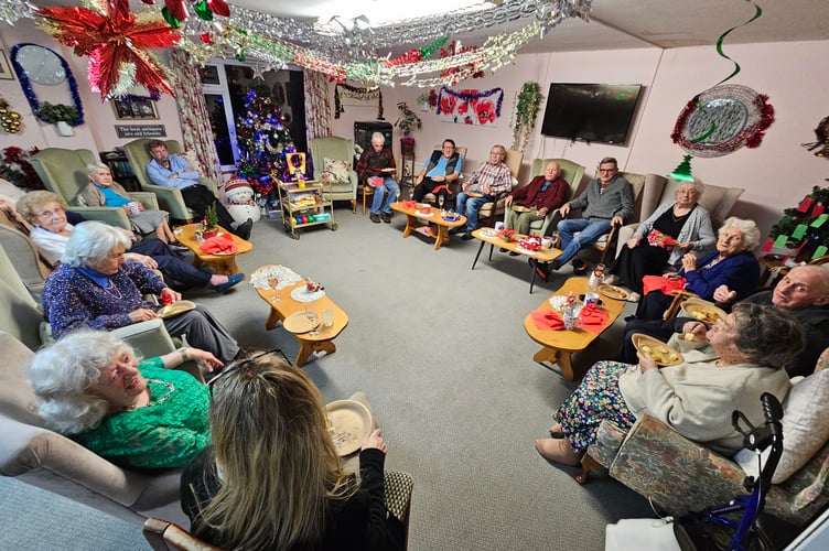 Residents of Ivy House, Wellington, enjoy their Christmas party.