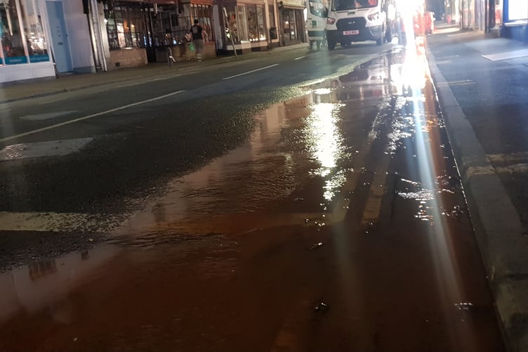 Water gushing along South Street in Wellington town centre on Tuesday night.
