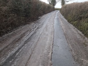 Crash on iced-up road with blocked drains