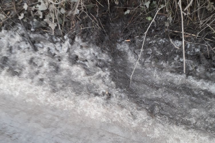 One of the drains in Burchills Hill, Wellington, completely covered by ice at the scene of a car crash on Saturday.