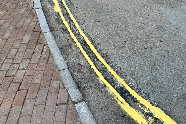 Contractors have had to repaint double yellow lines in Wiveliscombe because they were too wide.