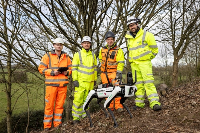 Spot, the robotic dog, with the trial team, from left, Callum Whitfield from BAM, Guy Swains, National Highways’ South West Engineering Team Manager, James Codd, AECOM’s Associate Director of Ground Engineering, and National Highways’ Principal Engineer David Hayward
