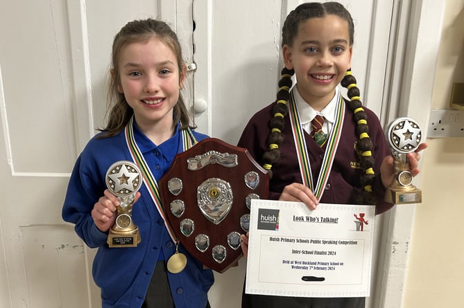 Betsy (left) and Alani, winners of a Richard Huish Trust primary schools public speaking and performance poetry contest.
