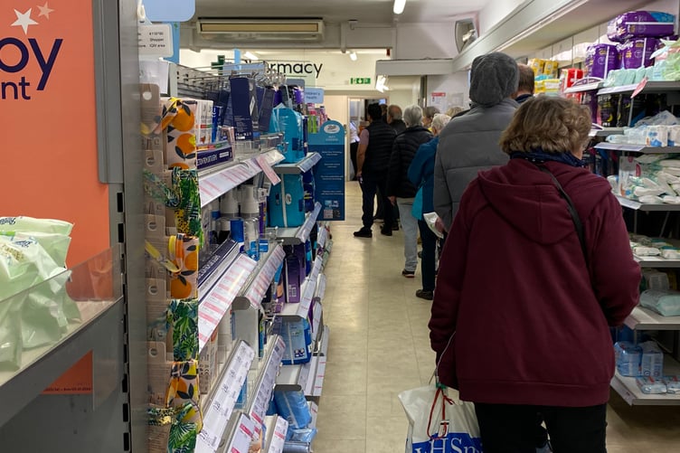 Some customers were forced to wait for more than an hour to collect their medicines as queues built up on the street outside
