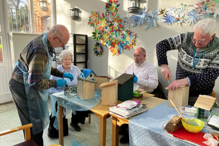 Residents of Nynehead Court, near Wellington, making bird boxes.